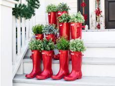 Add a touch of whimsy to your stoop or steps with a grouping of boots used as planters.